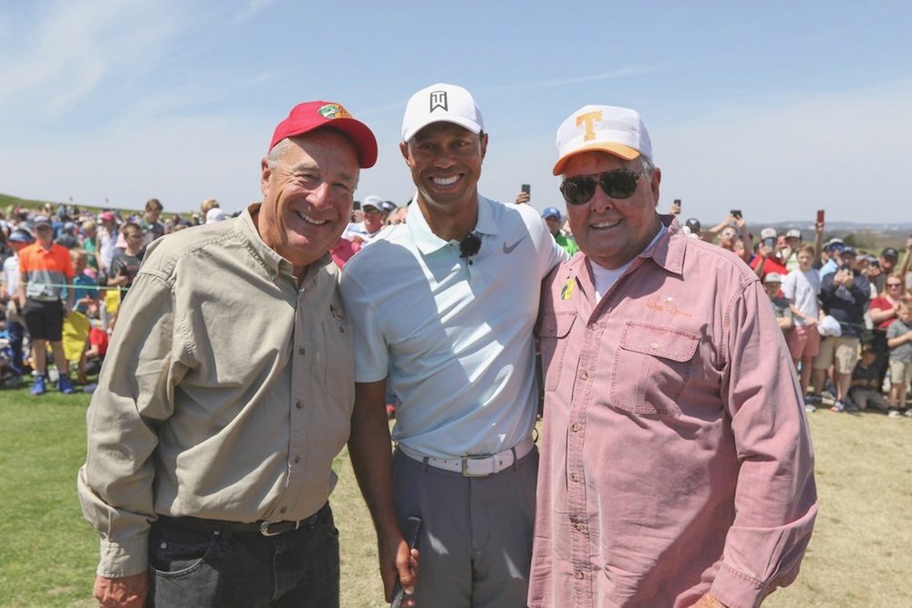 Tiger Woods, flanked by Johnny Morris, left, and professional angler Bill Dance, start the Legends of Golf tournament at Big Cedar Lodge with a children’s clinic.